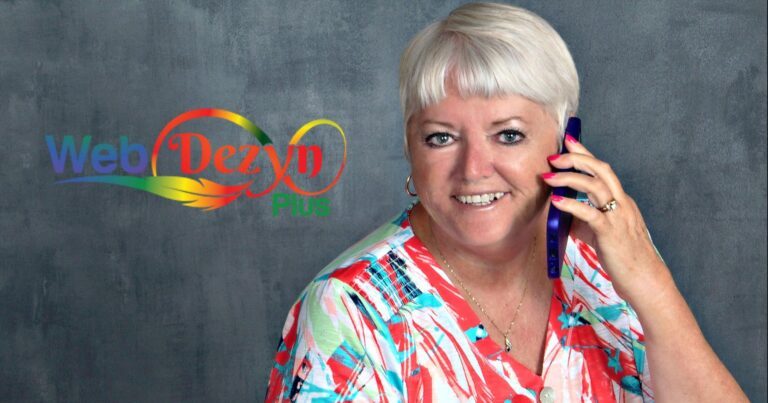 Smiling woman with grey hair holding a phone, Web Dezyn Plus logo in the background