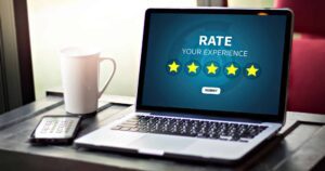 Laptop showing five-star rating prompt for user feedback