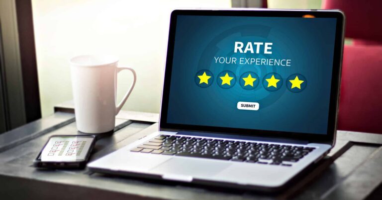Laptop showing five-star rating prompt for user feedback